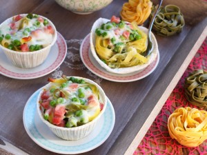 Ricetta Nidi di tagliatelle con prosciutto e piselli